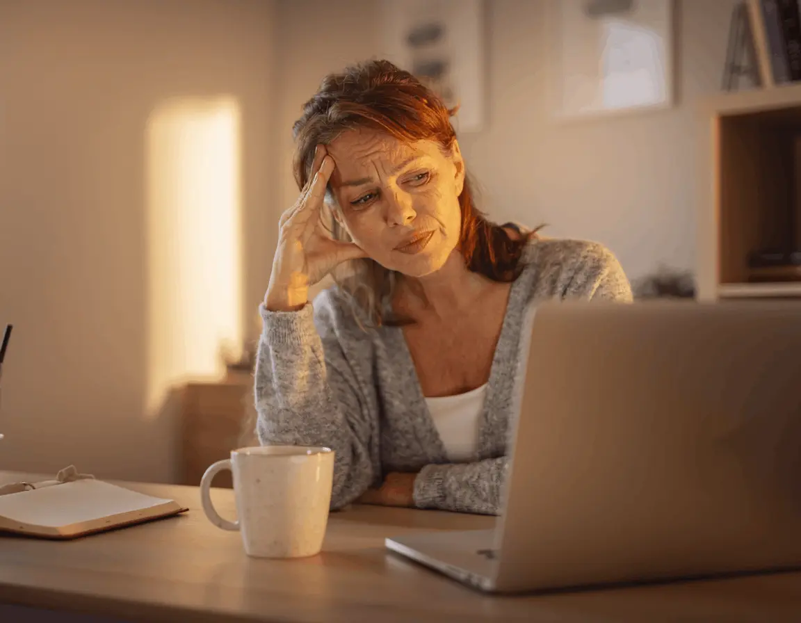 Woman experiencing brain fog at her desk